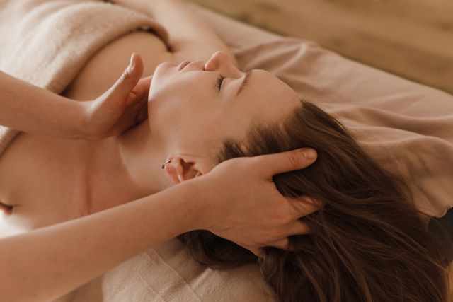 A guest enjoying a relaxing Japanese-inspired head spa massage