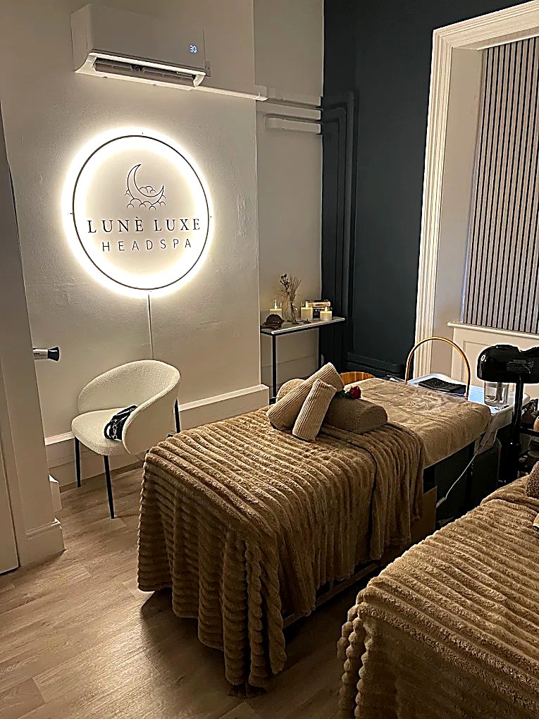A calm, candlelit head spa suite